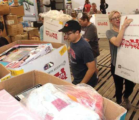 Volunteers prepare Toys for Tots warehouse as giving season begins