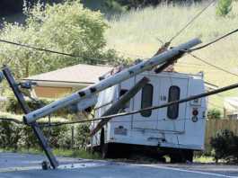 Truck tears out power lines and pole