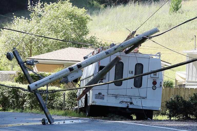 Truck tears out power lines and pole