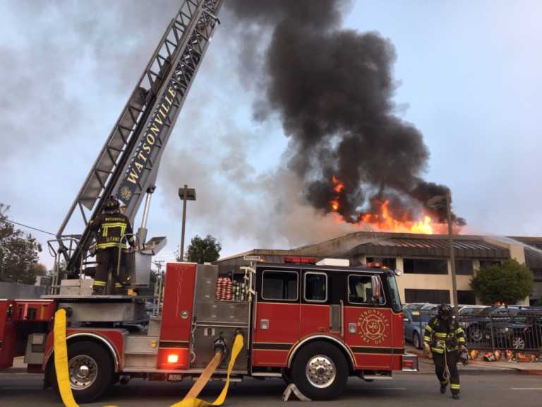 Fire engulfs car dealership