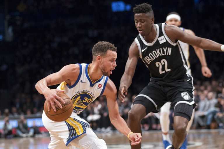 Curry scores 39, Warriors hold off Nets 118-111