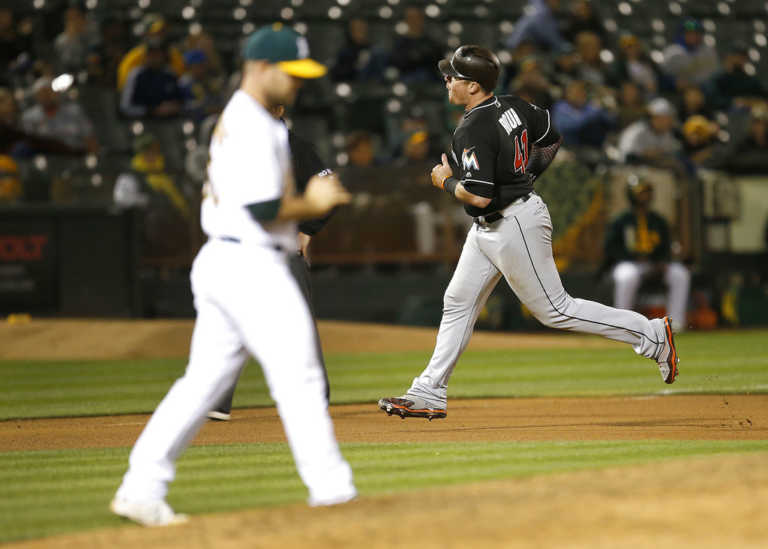 Bour's four hits helps Marlins hold off Athletics 11-9