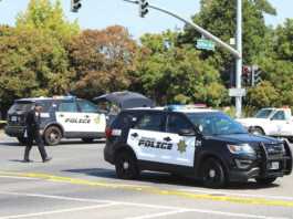 Police officer shoots suspect armed with knives