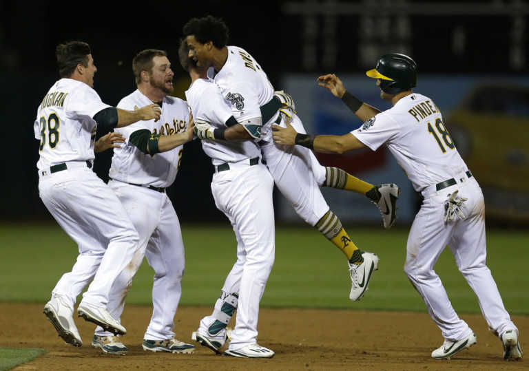 Khris Davis' bloop single in 10th lifts A's past Yankees 8-7