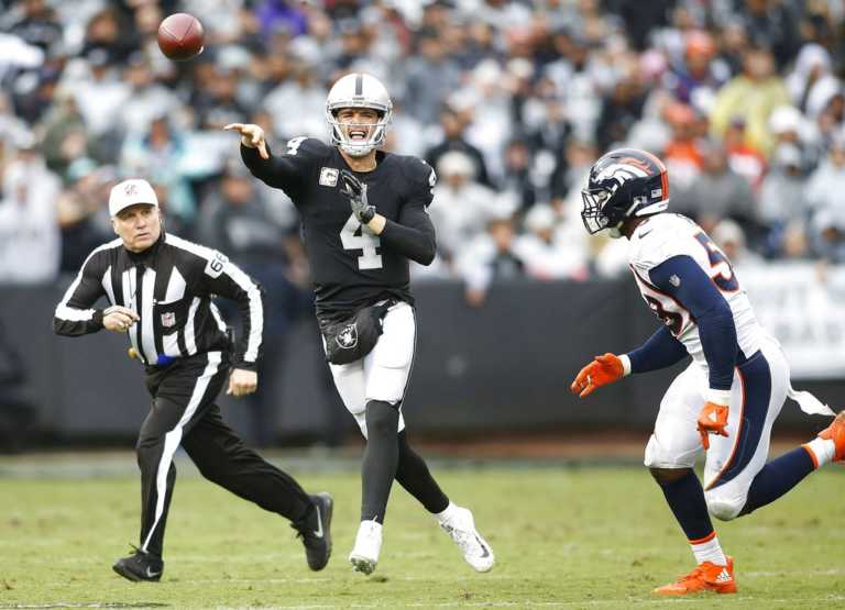 Raiders beat Broncos 21-14 in fight-filled game