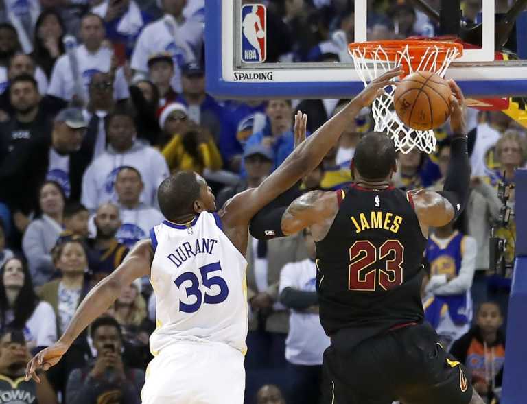 Durant delivers on both ends, Warriors beat Cavaliers 99-92