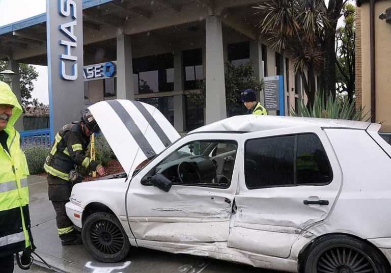 PHOTO: Car knocked onto sidewalk