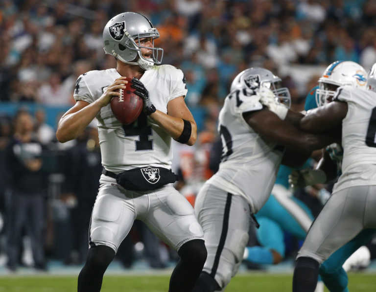 Carr throws for 300 yards to help Oakland beat Miami 27-24