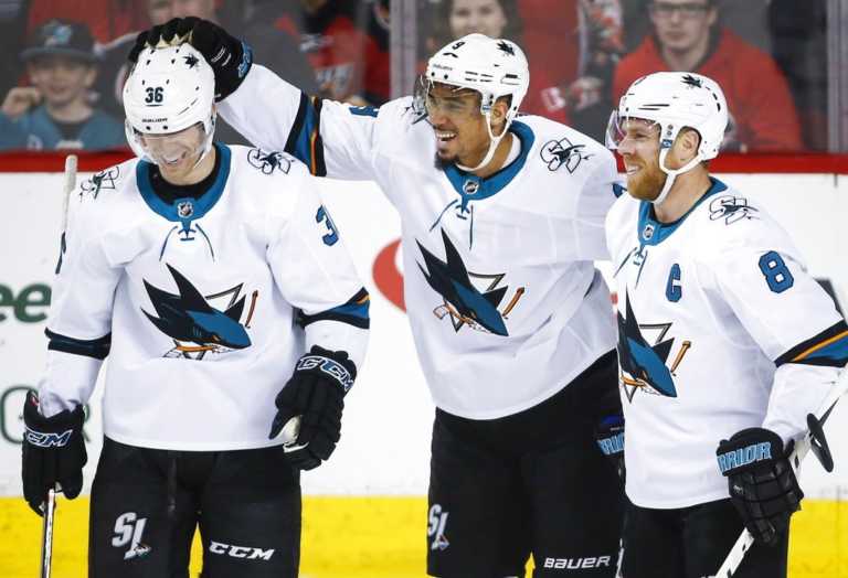 Kane scores 4 goals to lead Sharks past Flames 7-4