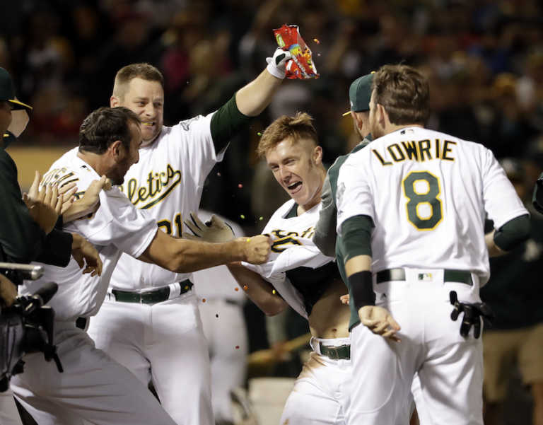 Canha's 10th-inning homer leads A's past Red Sox 3-2