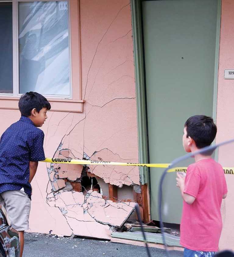 Car slams into hotel