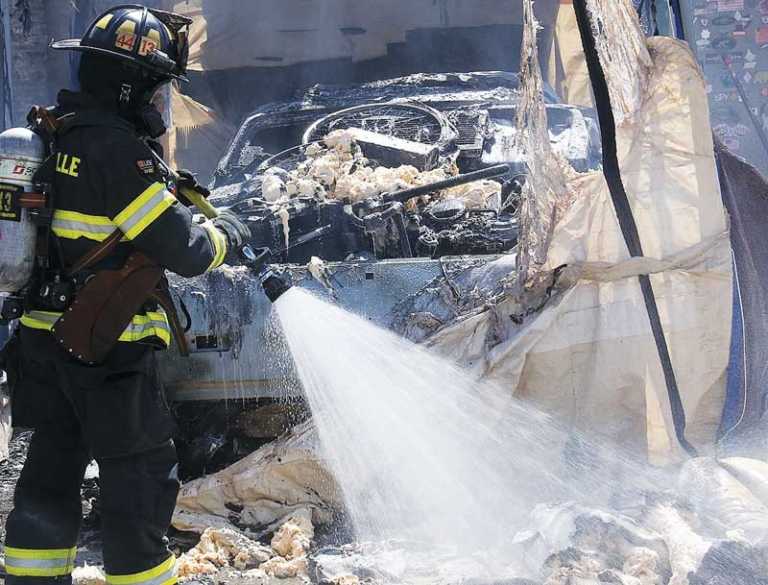 Car fire melts storage shelter