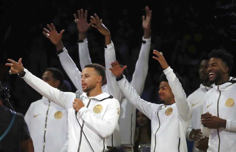Curry, Durant lead Warriors past Thunder in festive opener