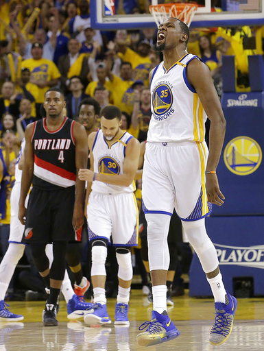 Durant shines in Golden State playoff debut in Game 1 win