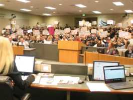 Teachers confront trustees