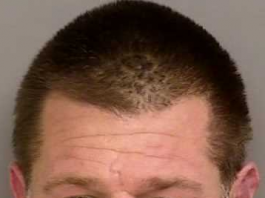 Man arrested with 10 stolen vehicles, shotgun