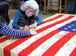 Flag-signing project honors Japanese Americans imprisoned during WWII Japanese americans