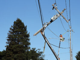 Crash damages power pole, snarls traffic