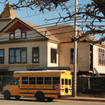 Image for display with article titled Townhome project featuring historic schoolhouse on the move