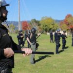 Image for display with article titled Officers Participate in Civil Disobedience Training