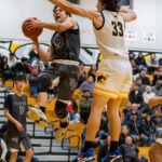 Image for display with article titled Sharks hand ‘Catz first loss in league play | Boys basketball