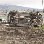 Image for display with article titled PHOTO: SUV rolls into ag field on Holohan Road