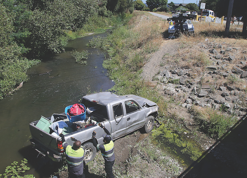 Image for display with article titled Truck Plunges Into Creek in Watsonville