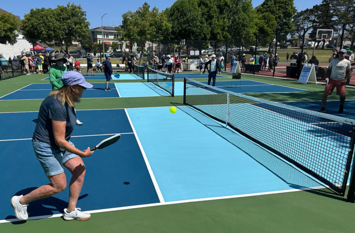 paj2526_callaghan-park-1-(1) People playing pickleball outdoors on a freshly built court