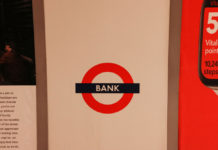 A sign for a bank, illustrating the traditional financial systems that instant withdrawal casinos are moving beyond