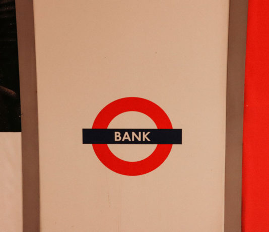 A sign for a bank, illustrating the traditional financial systems that instant withdrawal casinos are moving beyond