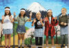 Five children performing on stage
