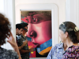 Visotors to the PV Art gallery look at various creations