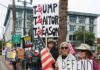 People line main street in Watsonville Saturday to protest President Trump's policies.