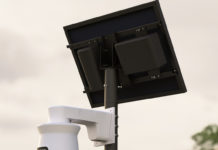 A close-up image of a Flock license plate reader.