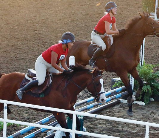 ‘People simply loved it:’ County fair wraps up These women take part in the pair jumping competition in the horse arena.