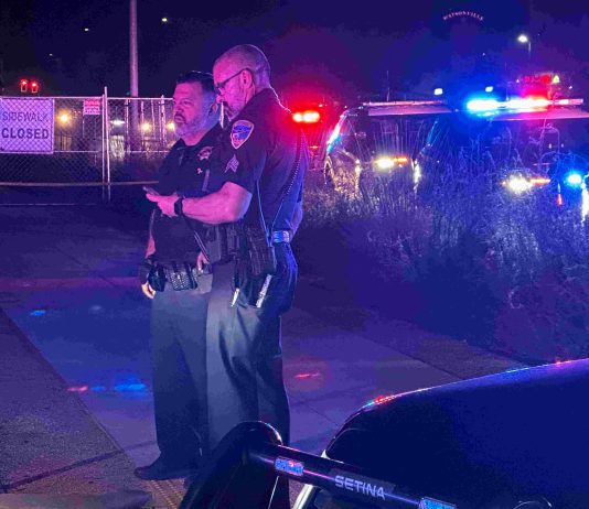 Man shot to death in Main Street business center