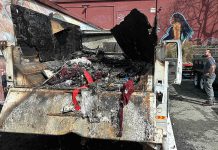 Chucky De Luna inspects the damage where a fire demolished a Ford F550 pickup at the rear loading area of Habitat for Humanity's Restore late Monday night on the 500 block of Main Street.