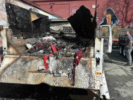 Chucky De Luna inspects the damage where a fire demolished a Ford F550 pickup at the rear loading area of Habitat for Humanity's Restore late Monday night on the 500 block of Main Street.