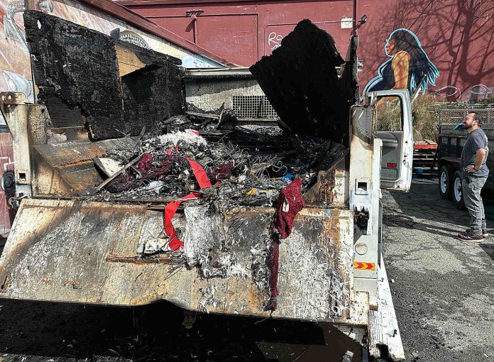 RESTORE truck fire Chucky De Luna inspects the damage where a fire demolished a Ford F550 pickup at the rear loading area of Habitat for Humanity's Restore late Monday night on the 500 block of Main Street.