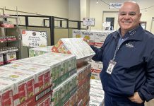 Dave Paz, general manager at S. Matinelli and Co.. assembles a sampling of beverage products Monday to add to the Pajaro Valley Chamber of Commerce and Agriculture’s red-carpet Super Bowl welcome party at the Watsonville Municipal Airport this week.