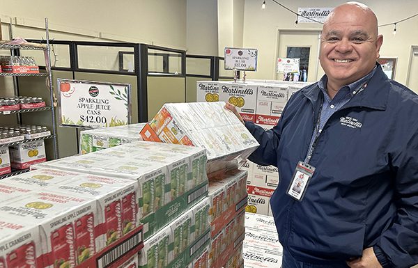 Dave Paz, general manager at S. Matinelli and Co.. assembles a sampling of beverage products Monday to add to the Pajaro Valley Chamber of Commerce and Agriculture’s red-carpet Super Bowl welcome party at the Watsonville Municipal Airport this week.