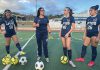 Gina Castañeda (second from left) works with the girls varsity soccer team at Aptos High School