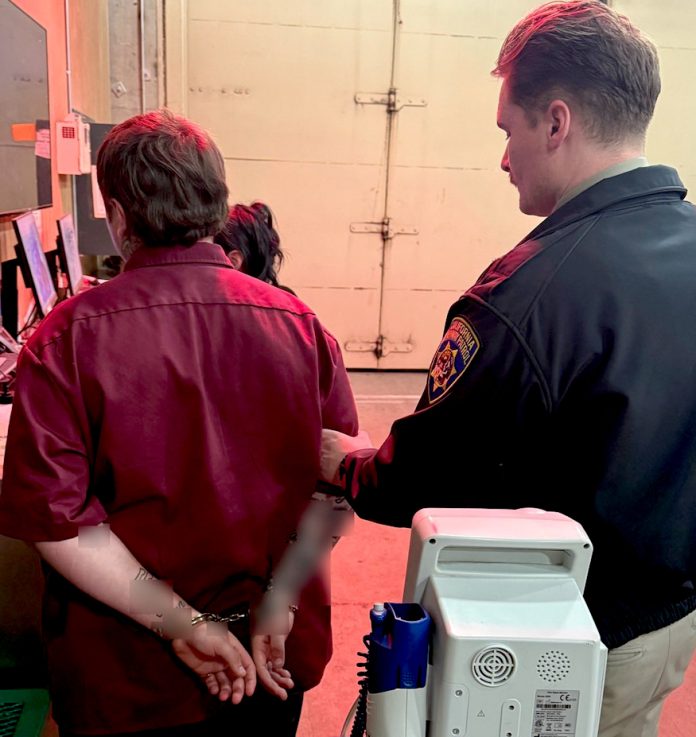 A California Highway Patrol officer takes a man into custody after he found an unregistered handgun in his possession during a car stop.