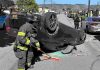 A Watsonville firefighter cleans up at the scene of a two-vehicle crash Tuesday afternoon on Center Street in Watsonville.