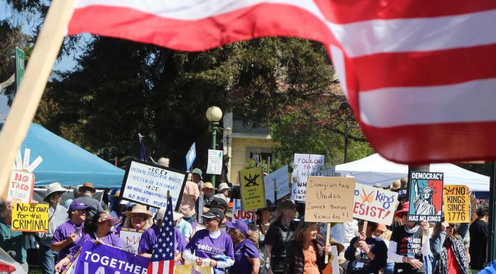 Around 600 people join the No Kings protest against President Trump Saturday in Watsonville Plaza along with thousands of others around the nation. From people in strollers to those in wheelchairs and on walkers, people waved signs and chanted "No Trump, No ICE" and "No War with Iran" during the two-hour event organized by Indivisible Pajaro Valley.