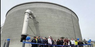 Watsonville Mayor Kristal Salcido (center with scissors) cuts the ribbon for the completion of a 2 million gallon water storage tank Monday on Burchell Avenue while joined by a cast of city officials.