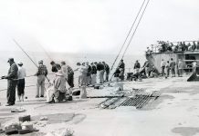 A crowd gathers on the deck of the SS Palo Alto, colloquially known as the “Cement Ship,” on May 31, 1954.