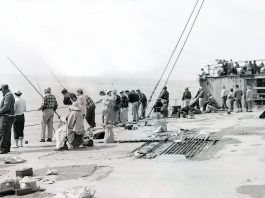 A crowd gathers on the deck of the SS Palo Alto, colloquially known as the “Cement Ship,” on May 31, 1954.