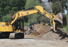 A crew from Granite Construction works on Reach 6 of the Pajaro River at Watsonville Project along Corralitos Creek. (