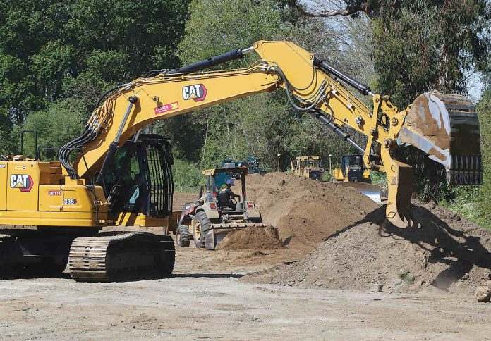 A crew from Granite Construction works on Reach 6 of the Pajaro River at Watsonville Project along Corralitos Creek. (